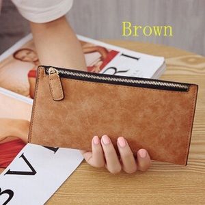 Woman’s faux leather zip wallet.